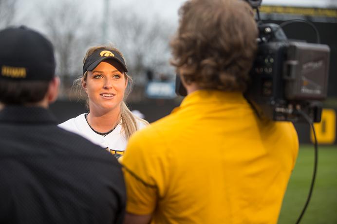 Iowa pitcher Shayla Starkenburg is interviewed after winning todays second game against Nebraska at Hawkeye Softball Complex on Wednesday, April 12. The Hawkeyes defeated Nebraska in both games, 4-3 and 5-2. (The Daily Iowan/Ben Smith)