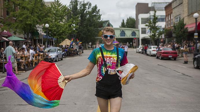 An IC Pride parade participant marches down Dubuque Street on Saturday, June 17, 2017. The parade is part of Pride Month, a celebration of the LGBTQ community and commemoration of the Stonewall riots of 1969. (Ben Smith/The Daily Iowan)