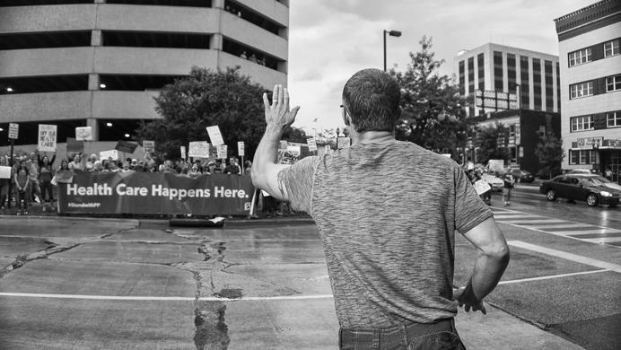 A Pro-Trump supporter scolds nearby protesters outside the venue for the Donald Trump rally in Cedar Rapids, Iowa on Wednesday, June 21, 2017. Interactions between the two sides were not always civil. (James Year/The Daily Iowan)