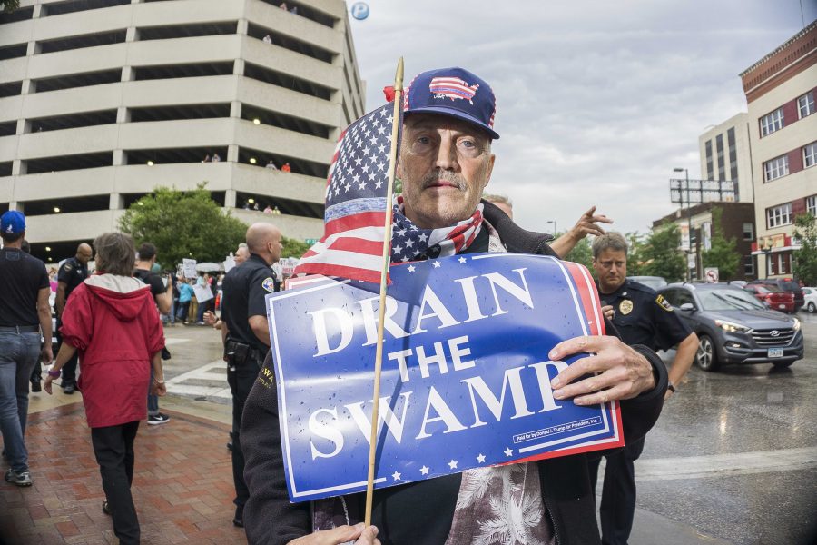 A Pro-Trump supporter poses for a photo outside the venue for the Donald Trump rally in Cedar Rapids, Iowa on Wednesday, June 21, 2017. The arena was filled to capacity and many of the supporters had to be turned away. (James Year/The Daily Iowan)