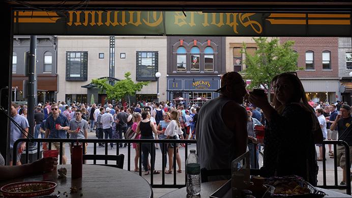 Attendees of the Block Party on Dubuque Street are seen from the Sports Column bar during the Iowa City Downtown District Block Party on Saturday June 25, 2017. The Block Party, hosted by the ICDD was the first use of Iowa City's changed rules allowing open containers for select events downtown (Nick Rohlman/The Daily Iowan)