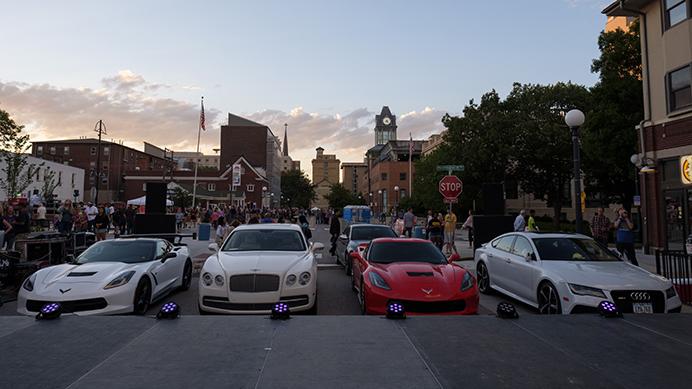 A selection of cars are seen on Linn Street before the Iowa city Fashion 500 fashion show during the Iowa City Downtown District Block Party on Saturday June 25, 2017. The cars were used as a backdrop for the fashion show. The Block Party, hosted by the ICDD was the first use of Iowa City's changed rules allowing open containers for select events downtown (Nick Rohlman/The Daily Iowan)