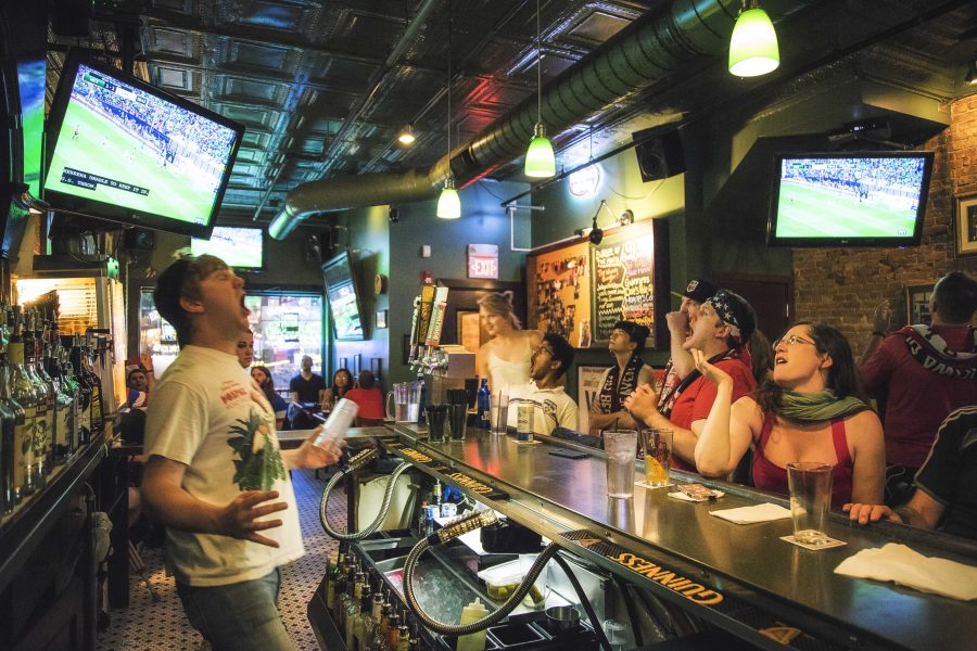 The American Outlaws football club enjoy the game at Donnellys Pub on June 11, 2017.  The pub was a high energy atmosphere during the tight match that resulted in a 1-1 draw between the American and Mexican teams. The group was also cheering on their chapter president who was seen in the stands at the game in Mexico. (The Daily Iowan/James Year)