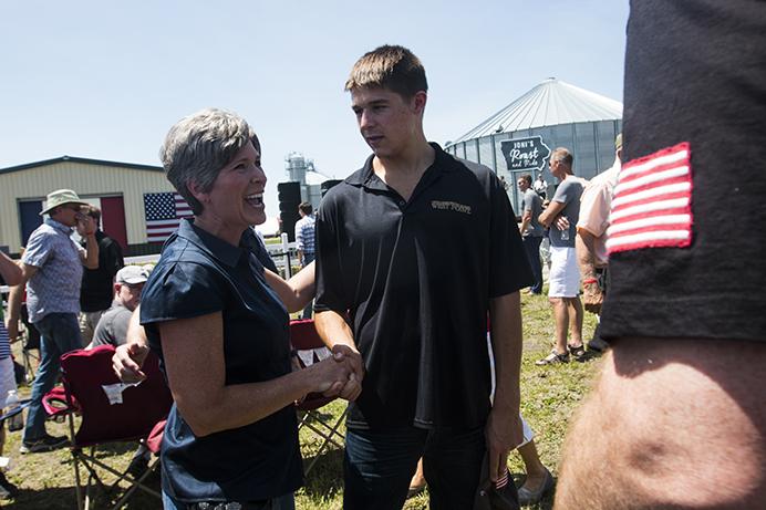 Sen. Joni Ernst, R-Iowa, laughs with a constituent during the third annual Roast and Ride event in Boone, Iowa, on Saturday, June 3, 2017. Guests included Vice President Mike Pence; Sen. Tim Scott, R-S.C.; Sen. Chuck Grassley, R-Iowa; Iowa Gov. Kim Reynolds; and Rep. Steve King, R-Iowa. (The Daily Iowan/Joseph Cress)