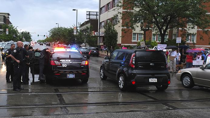 A protestor is arrested outside of a Donald Trump rally in Cedar Rapids Iowa on Wednesday June 21, 2017. (Nick Rohlman/The Daily Iowan)