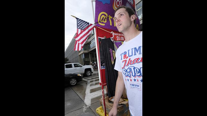 A suporter of Donal Trump walks outside of a Donald Trump rally in Cedar Rapids on Wednesday June 21, 2017. (Nick Rohlman/The Daily Iowan)