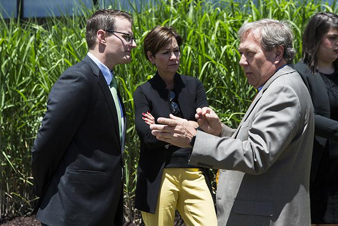 University of Iowa President J. Bruce Harreld, right, speaks with Lt. Gov. Adam Gregg, left, and Iowa Gov. Kim Reynolds, center, during a visit on the University of Iowa campus to learn about diversifying biomass fuel sources on at the Cambus Maintenance Facility on Wednesday, June, 7, 2017. Reynolds and Gregg met with President Harreld and other university experts on their visit while discussing the universitys biomass portfolio. (The Daily Iowan/Joseph Cress)