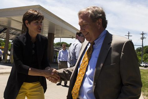 Iowa Gov. Kim Reynolds shakes hands with UI President Bruce Harreld after a visit on the UI campus to learn about diversifying biomass fuel sources on at the Cambus Maintenance Facility on Wednesday, June, 7, 2017.