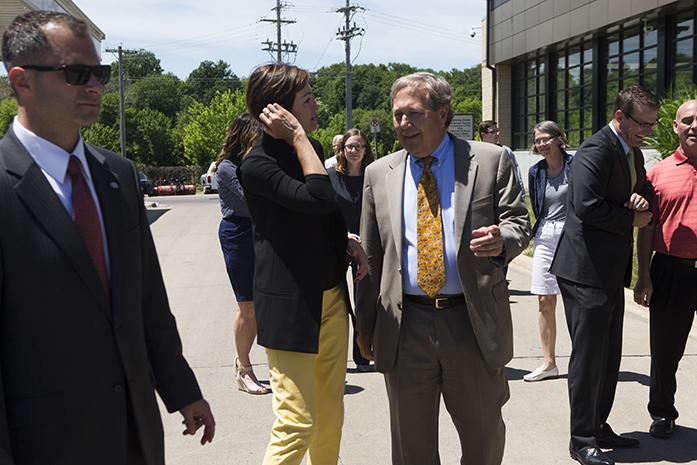 Iowa Gov. Kim Reynolds talks with University of Iowa President J. Bruce Harreld after a visit on the University of Iowa campus to learn about diversifying biomass fuel sources on at the Cambus Maintenance Facility on Wednesday, June, 7, 2017. Reynolds and Lt. Gov. Adam Gregg met with Harreld and other university experts on their visit while discussing the universitys biomass portfolio. (The Daily Iowan/Joseph Cress)
