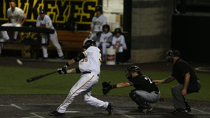 Iowa first baseman Jake Adams hits the pitch deep during the game between Omaha-Iowa at Duane Banks Field on Tuesday, May 16, 2017. The Hawkeyes pull off another comeback win with three runs in the 8th inning and two runs in the 9th inning for the 9-8 victory. (The Daily Iowan/Alex Kroeze)