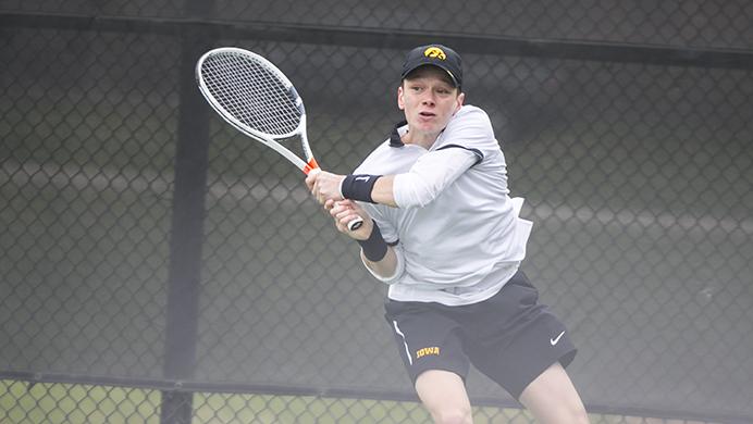 Iowas Jason Kerst returns a serve during the match against Penn State at Klotz Outdoor Tennis Courts on Sunday, Apr. 2, 2017. Jake Jacoby and Jason Kerst, were recognized by the International Tennis Association for their academic achievement in the 2016-17 season. (The Daily Iowan/Ben Smith)