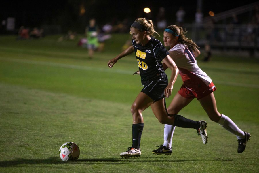 FILE - In this file photo, Hawkeye forward Cloe Lacasse dribbles past a defender in a game against Fresno State Friday, August 29, 2014. (The Daily Iowan/Sergio Flores)