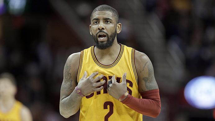 FILE - In this Feb. 27, 2017, file photo, Cleveland Cavaliers Kyrie Irving talks with a teammate in the first half of an NBA basketball game against the Milwaukee Bucks in Cleveland. Two people familiar with the situation says All-Star guard Kyrie Irving has asked the Cavaliers to trade him. Irving made the request last week to owner Dan Gilbert, said the persons who spoke Friday, July 21, 2017,  to the Associated Press on condition of anonymity because the team is not commenting on the star’s demands.  (AP Photo/Tony Dejak, File)
