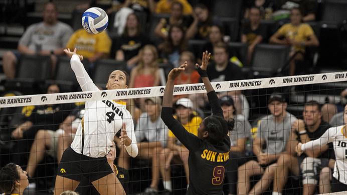 Iowa%E2%80%99s+Ashley+Mariani+%284%29+prepares+to+spike+the+ball+as+Arizona+State%E2%80%99s+Jasmine+Koonts+%289%29+tries+to+block+it+in+Carver-Hawkeye+on+Sept.+2+%2C+2016.+%28The+Daily+Iowan%2FTing+Xuan+Tan%29