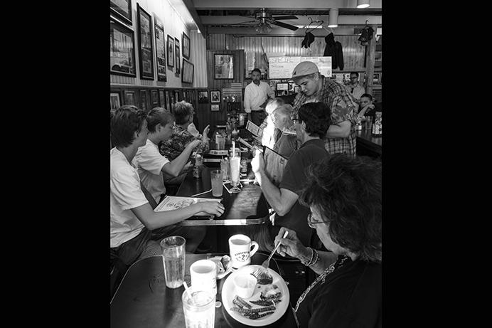 Iowa 2nd Congressional District candidate Chris Peters speaks with customers at the Hamburg Inn on Sunday July 31, 2017. Peters is running against Rep. Dave Loebsack in 2018. (Nick Rohlman/The Daily Iowan)