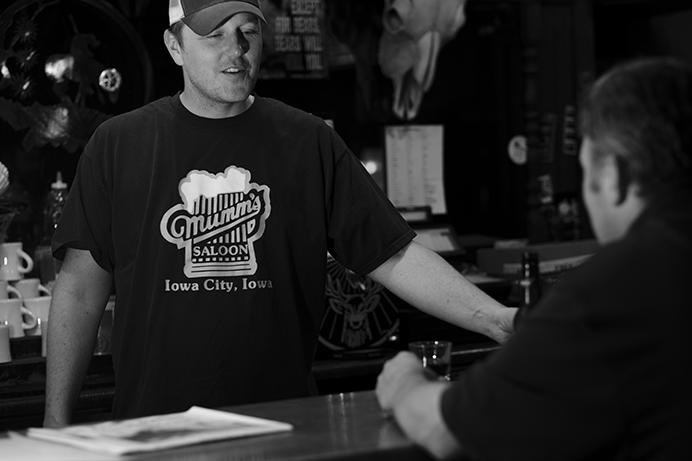 Bartender Ben Mummey talks to patrons at the Deadwood Tavern in Iowa City on Thursday June 29, 2017. On July 1,  Ben Mummey bought the Deadwood from longtime owner Jim Bell. (Nick Rohlman/The Daily Iowan)