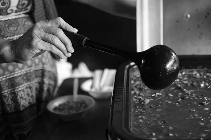 Bartender Sally Callahan serves chili at the Deadwood Tavern in Iowa City on Thursday June 29, 2017. Callahan serves food at the deadwood during home football games and other sporting events such as the superbowl. (Nick Rohlman/The Daily Iowan)