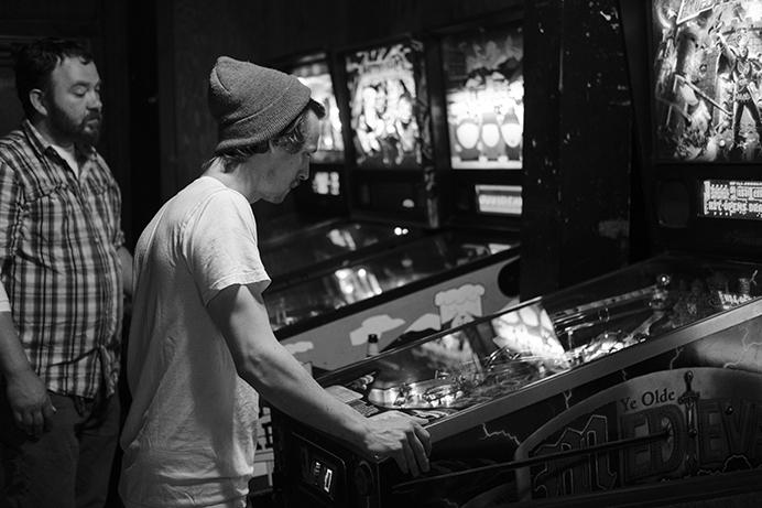 Patrons play pinball at the Deadwood Tavern in Iowa City on Thursday June 29, 2017. On July 1,  Ben Mummey bought the Deadwood from longtime owner Jim Bell. (Nick Rohlman/The Daily Iowan)