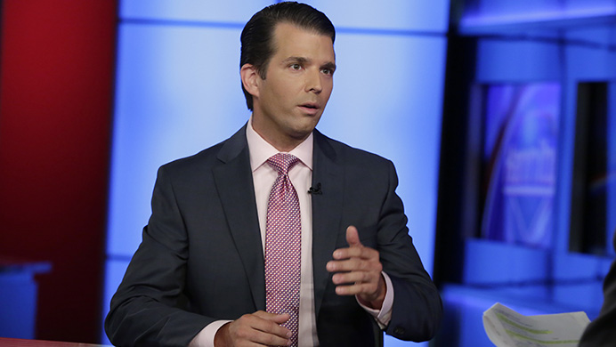 In this photo taken July 11, 2017, Donald Trump Jr. is interviewed by host Sean Hannity on his Fox News Channel television program, in New York. A Russian-American lobbyist says he attended a June 2016 meeting with President Donald Trumps son, marking another shift in the account of a discussion that was billed as part of a Russian government effort to help the Republicans White House campaign.  (AP Photo/Richard Drew)