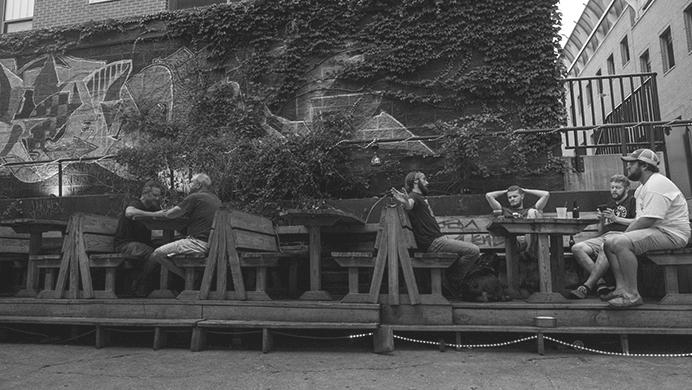 Patron's relax in the shade in the beer garden at Gabe's Oasis in Iowa City on Monday July 10, 2017. Temperatures reached 90 degrees with humidity of eighty one percent on Monday. (Nick Rohlman/The Daily Iowan)