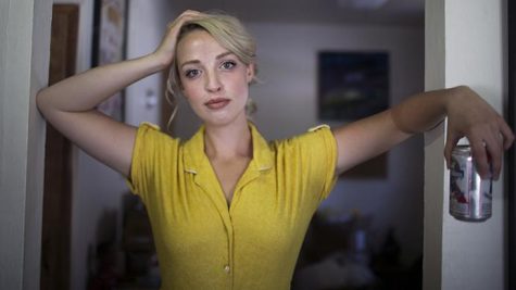 Elizabeth Moen stands in her home on July 21, 2017. Moen is an Iowa City-based musician who has been featured in festivals ranging from Mission Creek to 80/35 in Des Moines. She made her start in Iowa City some years ago, and she has previously worked at Short’s, where she also played. (Ben Smith/The Daily Iowan) 