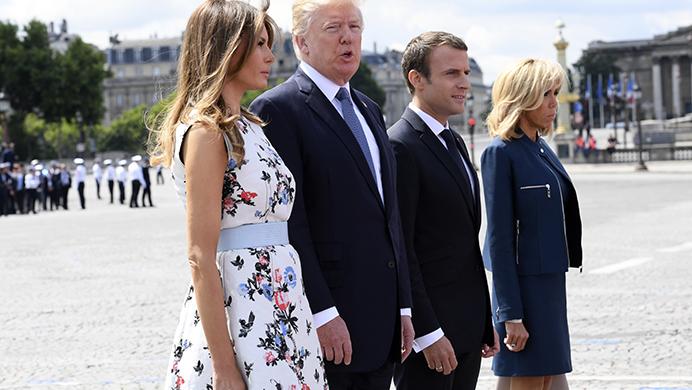 French President Emmanuel Macron, second right, and his wife Brigitte Macron, right,walk with U.S President Donald Trump and First Lady Melania Trump after the Bastille Day military parade on the Champs Elysees avenue in Paris Friday, July 14, 2017. Frances annual Bastille Day parade turned into an event high on American patriotism this year, marked by a warm embrace between President Donald Trump and his French counterpart. (Christophe Archambault, Pool via AP)
