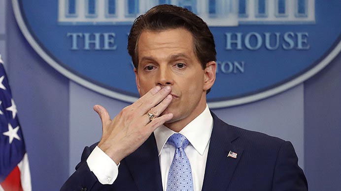 In this July 21, 2017 photo, incoming White House communications director Anthony Scaramucci, right, blowing a kiss after answering questions during the press briefing in the Brady Press Briefing room of the White House in Washington. Scaramucci is out as White House communications director after just 11 days on the job.  A person close to Scaramucci confirmed the staffing change just hours after President Donald Trump’s new chief of staff, John Kelly, was sworn into office. (AP Photo/Pablo Martinez Monsivais)