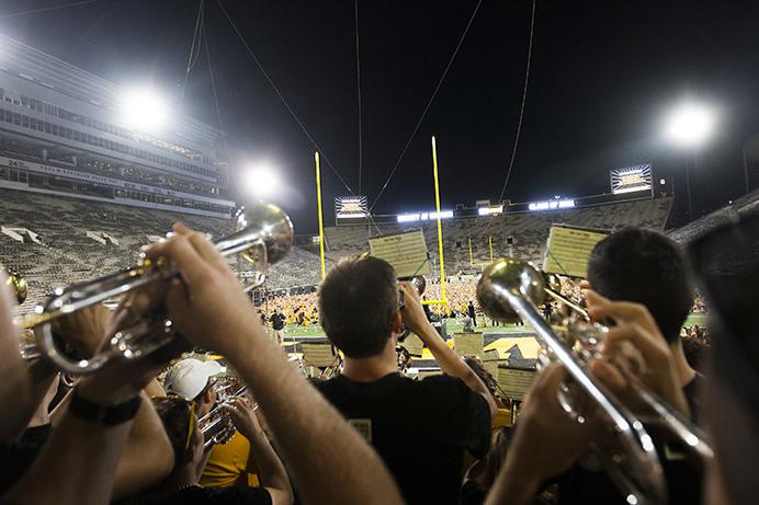 Members of the Hawkeye Marching band play during the first week before classes during the OnIowa program at Kinnick Stadium on Friday, August 18, 2017. Kick off at Kinnick offered first year students an opportunity to legally walk on the historic field with their classmates. (Joseph Cress/The Daily Iowan)