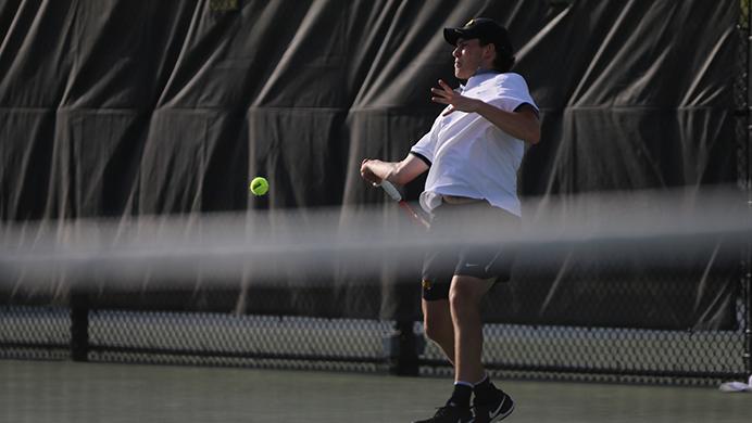 FILE - Iowa’s Jonas Larsen returns a ball during the Iowa-North Dakota match at the Hawkeye Tennis & Recreation Complex on April 23. Larsen is one of the five returning Hawkeyes heading into the 2017-18 season; the team needs six to compete. (File photo/The Daily Iowan)