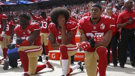 From left, San Francisco 49ers' Eli Harold (58), quarterback Colin Kaepernick (7) and Eric Reid (35) kneel during the national anthem before their NFL game against the Dallas Cowboys on Sunday, Oct. 2, 2016 in Santa Clara, Calif. (Nhat V. Meyer/Bay Area News Group/TNS)