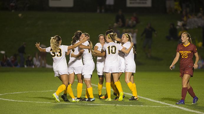 Iowa players celebrate the winning goal during the Iowa vs. Iowa State soccer game on Aug. 25. Iowa won, 1-0,
 in extra time. (Nick Rohlman/The Daily Iowan)