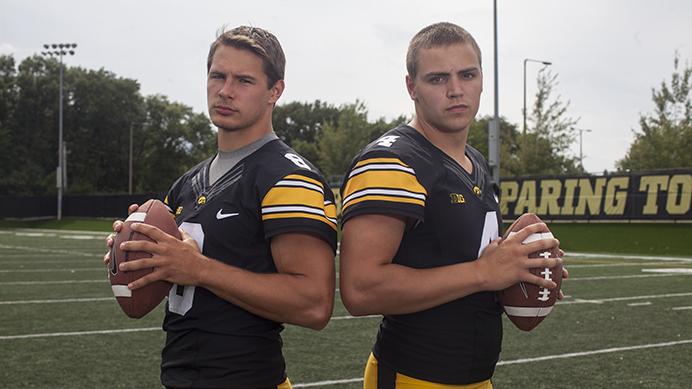 Iowa quarterbacks Tyler Wiegers and Nathan Stanley stand ready during the Iowa football media day on Aug. 5. The Hawkeyes will open the 2017 season at home against Wyoming on Sept. 2. (Nick Rohlman/The Daily Iowan)