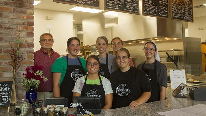 The Encounter Cafe staff stand for a portrait on Wednesday, Aug. 30, 2017. The Encounter Cafe opened its doors to the public on August 23, 2017, to many positive reviews. (Lily Smith/The Daily Iowan)