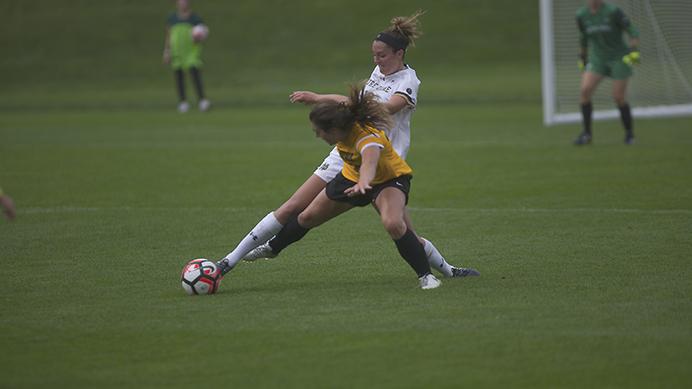 Karly+Stuenkel+challenges+for+the+ball+against+Ginny+McGowan+of+Notre+Dame+in+Iowa+City%2C+at+the+UI+Soccer+Complex+on+Sunday%2C+Aug.+27%2C+2017.+The+Hawkeyes+lost+2-0+to+the+Fighting+Irish.+%28Paxton+Corey%2FThe+Daily+Iowan%29