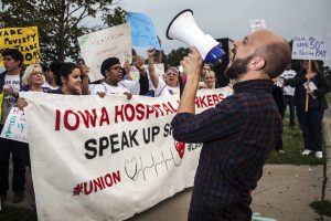Organizers and protestors chant in support of laborers during a Labour Walkout event in Des Moines on Monday, Sept. 4, 2017. Organizations in support of laborers across Iowa such as Service Employees International Union, Iowa Citizens for Community Improvement, and Democratic Socialists of America participated in the rally. (Ben Smith/The Daily Iowan)
