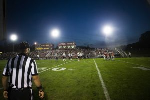 An official watches play during a 4A varsity high school football game between Iowa City High and West High at Bates Field in Iowa City on Friday, Sept. 15, 2017. (Joseph Cress/The Daily Iowan)