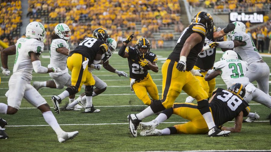 Iowa+running+back+Ivory+Kelly-Martin+%2821%29+runs+the+ball+up+the+middle+during+the+game+between+Iowa+and+North+Texas+at+Kinnick+Stadium+on+Saturday%2C+Sept.+16%2C+2017.+The+Hawkeyes+went+on+to+defeat+the+Mean+Green+31-14.+%28Ben+Smith%2FThe+Daily+Iowan%29