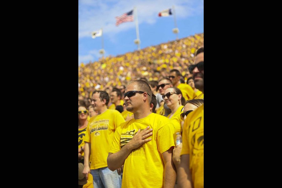 Fans stand for the National Anthem before the game between Iowa and North Texas at Kinnick Stadium on Saturday Sept. 16, 2017. (Nick Rohlman/The Daily Iowan)