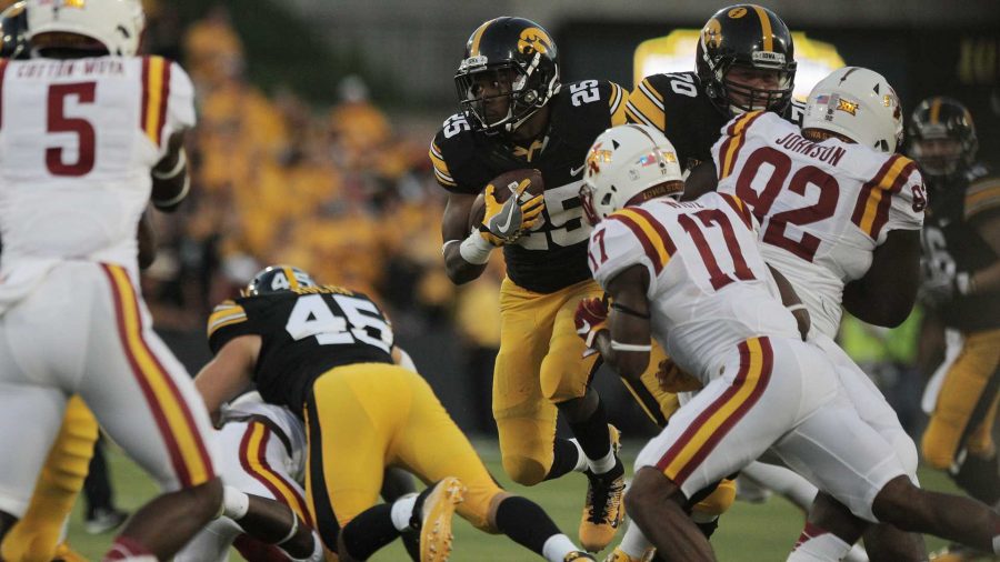 FILE+-+Iowa+running+back+Akrum+Wadley+runs+up+the+middle+during+the+Iowa-Iowa+State+game+at+Kinnick+on+Saturday%2C+Sept.+10%2C+2016.+Iowa+head+Iowa+State+to+one+field+goal+to+defeated+them%2C+45-3.+%28The+Daily+Iowan%2FMargaret+Kispert%2C+file%29