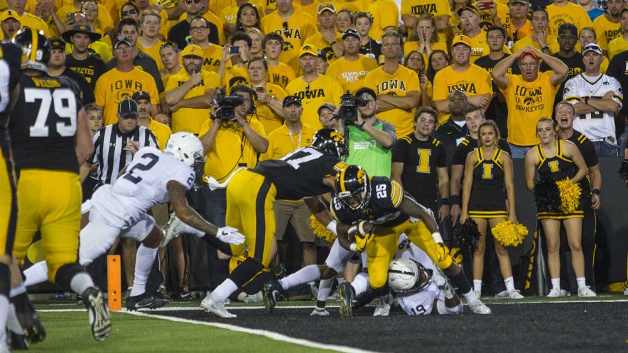 Iowa running back Akrum Wadley gets tackled for a safety during Iowa's game against Penn State at Kinnick Stadium on Sept. 23, 2017. Penn State defeated Iowa 21-19 on a last-second touchdown pass. (Nick Rohlman/The Daily Iowan)