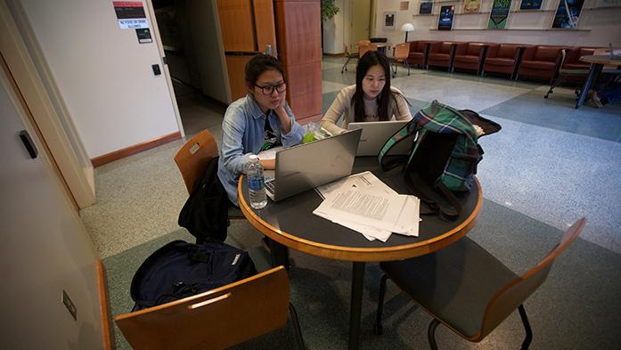 UI students Inhee Choi, left, and Minsook Choi study inside the engineering building on Tuesday, March 22, 2016. According to the Department of Homeland Security, international students who graduate with science, technology, engineering, and mathematics (STEM) degrees may now participate in Optional Practical Training. (File photo/The Daily Iowan)