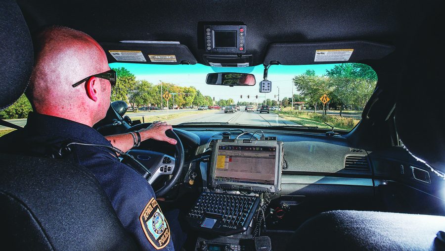 Sgt. Derek Frank of the Iowa City police patrols on Highway 6 on Wednesday. Frank has been on the force for 19 years. (James Year/The Daily Iowan)