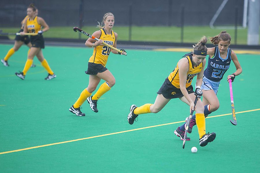 Iowas Madeleine Murphy (26) runs from UNCs Eva Smolenaars (21) during a field hockey game during the Big Ten/ACC Challenge at Grant Field in Iowa City on Sunday, Aug. 27, 2017. The Hawkeyes fell to the Tarheels, 3-0. (Lily Smith/The Daily Iowan)