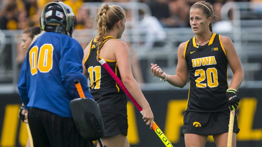 Iowas Sophie Sunderland (20) talks with Kaite Birch (11) and Katie Jones (00) during a field hockey game during the Big Ten/ACC Challenge at Grant Field in Iowa City on Saturday, Aug. 26, 2017. The Hawkeyes fell to Wake Forest, 3-2. (Joseph Cress/The Daily Iowan)