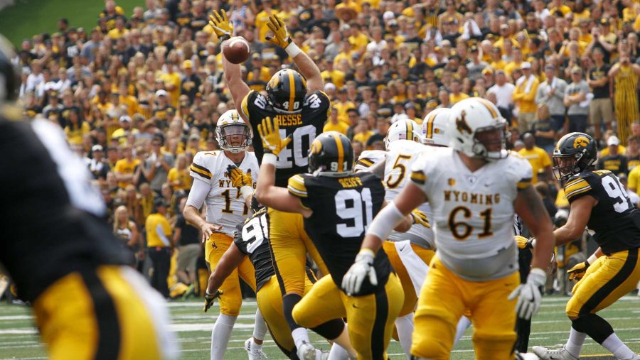 Iowa defensive end Parker Hesse attempts to block Wyoming quarterback Josh Allens pass during an NCAA football game between Iowa and Wyoming in Kinnick Stadium on Saturday, Sept. 2, 2017. The Hawkeyes defeated Wyoming, 24-3. (Joseph Cress/The Daily Iowan)