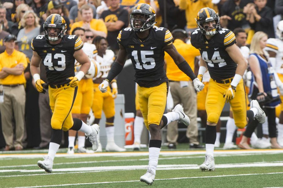 Iowa defensive back Joshua Jackson (15) celebrates after a stop during an NCAA football game between Iowa and Wyoming in Kinnick Stadium on Saturday, Sept. 2, 2017. The Hawkeyes defeated Wyoming, 24-3. (Joseph Cress/The Daily Iowan)