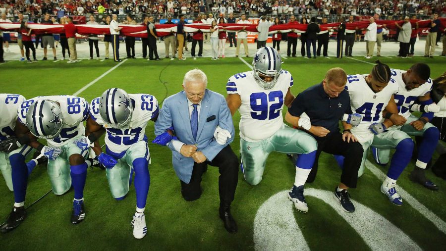 Dallas Cowboys players and staff including owner Jerry Jones and head coach Jason Garrett all take a knee before the singing of the National Anthem prior to the start of a game against the Arizona Cardinals at University of Phoenix Stadium Monday, Sept. 25, 2017 in Glendale, Ariz. (Vernon Bryant/The Dallas Morning News/TNS) 

NO MAGAZINE SALES MANDATORY CREDIT; NO SALES; INTERNET USE BY TNS CONTRIBUTORS ONLY