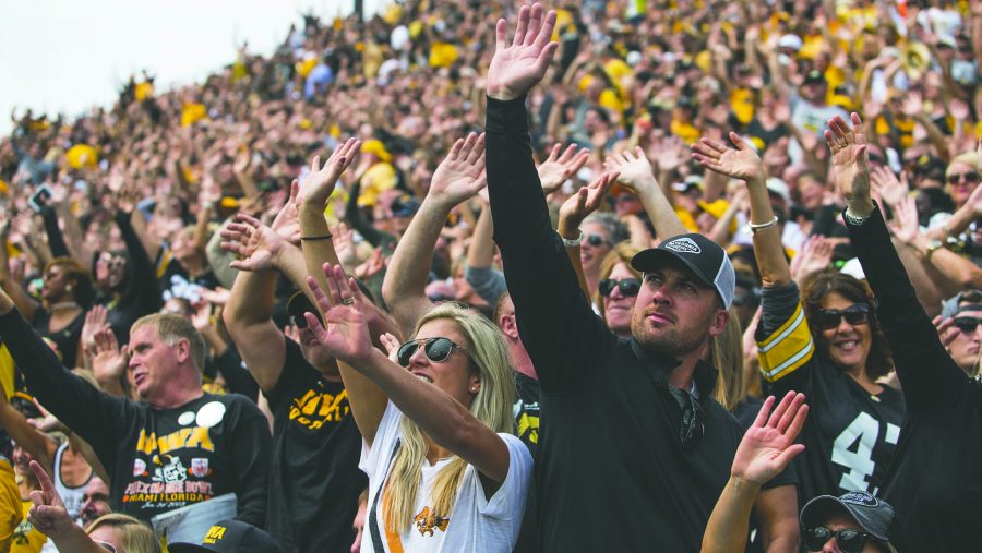 Iowa fans wave to kids in the Stead Family Childrens Hospital during an NCAA football game between Iowa and Wyoming in Kinnick Stadium on Saturday, Sept. 2, 2017. The Hawkeyes defeated Wyoming, 24-3. (Joseph Cress/The Daily Iowan)