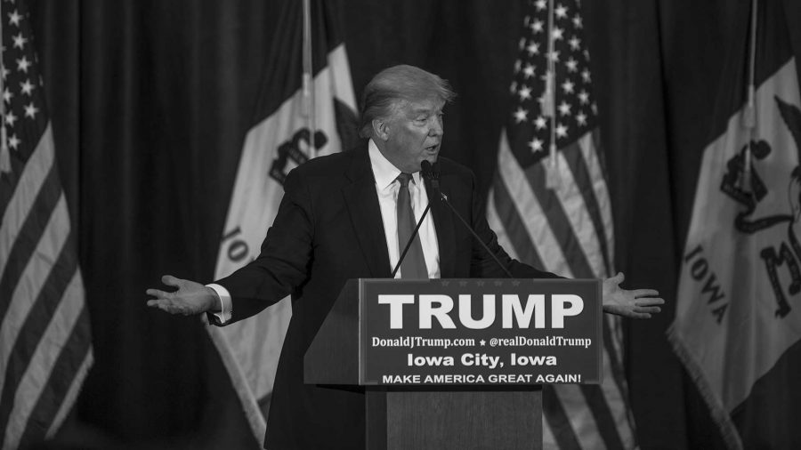 Donald Trump speaks to a crowd at the University of Iowa Field house on Tuesday Jan 26, 2016. Trump is currently tied in Iowa with Ted Cruz. (The Daily Iowan/Jordan Gale)