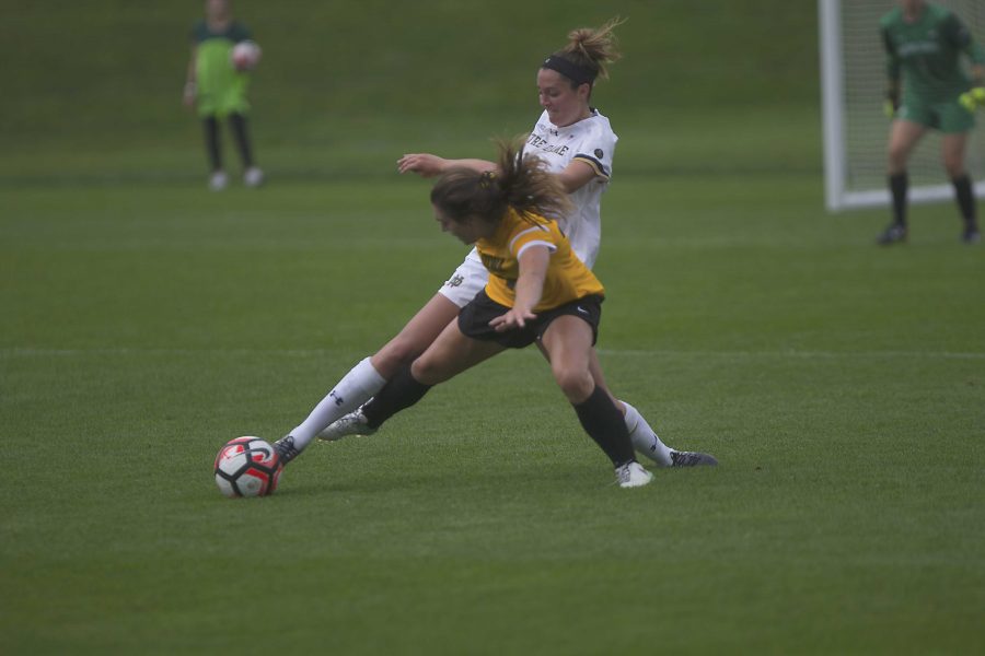 Karly Stuenkel challenges for the ball against Ginny McGowan of Notre Dame in Iowa City, at the UI Soccer Complex on Sunday, Aug. 27, 2017. The Hawkeyes lost 2-0 to the Fighting Irish. (Paxton Corey/The Daily Iowan)